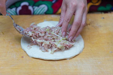woman prepares soft, juicy korean manti