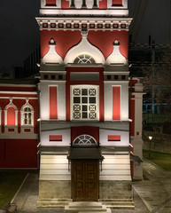 festive elegant red and white Orthodox church in the evening light