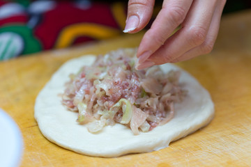 woman prepares soft, juicy korean manti