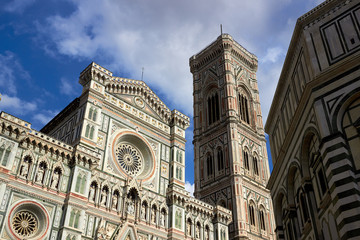 Fototapeta premium Detail of the facade of the Basilica di Santa Maria del Fiore (Florence Cathedral or Cathedral of Saint Mary of the flower), the main church of Florence, Italy. Bottom view.