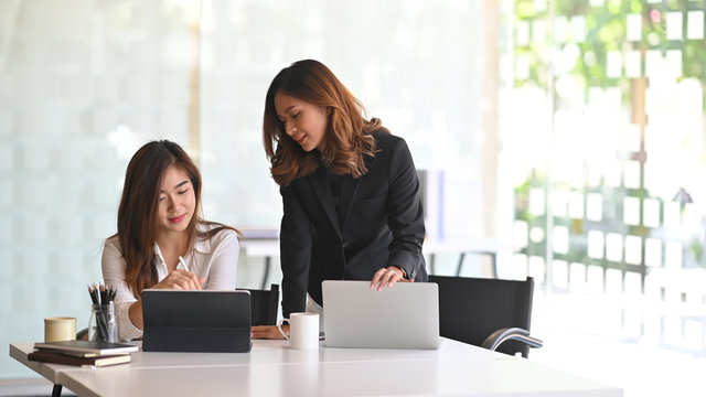 Colleagues businesswoman working they project in modern office.