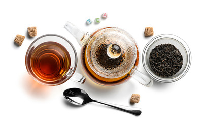 Black tea and accessories top view on white background