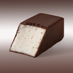 Candy slice whipped Cream in chocolate on a white brown background