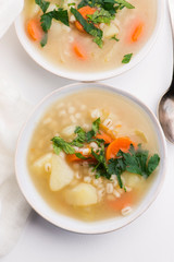 Barley soup, pearl barley in white bowl