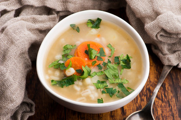 Barley soup, pearl barley in white bowl