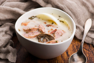 Traditional easter white borscht with eggs and sausage