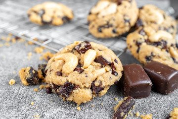 Stack of tasty chocolate cookies on gray table