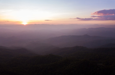colorful dramatic sky with cloud at sunset  in the mountains