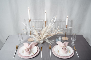 Setting Easter table with candles