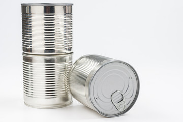 Group of silver canned food on white background.