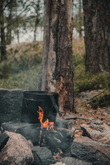 Cooking food in a pan on fire
