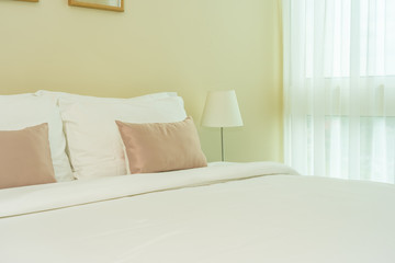 White comfortable pillow on bed decoration interior