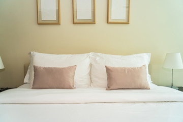 White comfortable pillow on bed decoration interior