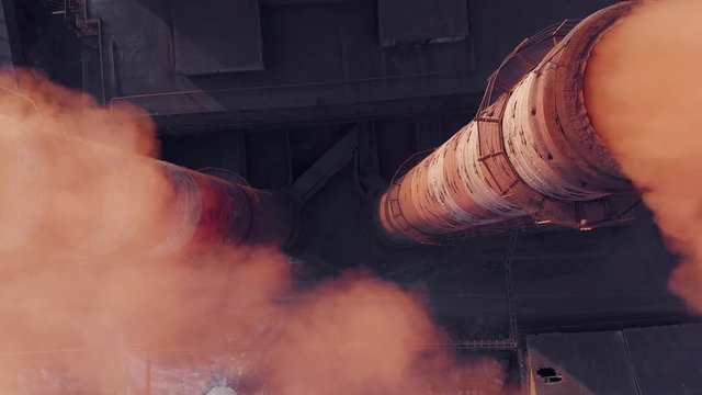 Aerial view pf industrial smokestack. Emission to atmosphere from industrial pipes, air pollution concept. Smokestack pipes shooted with drone.