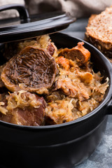 Traditional polish sauerkraut (bigos) with mushrooms and plums for christmas
