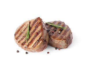 Delicious grilled beef medallions with rosemary and peppers mix isolated on white
