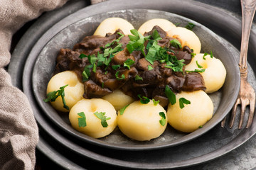 Potato dumplings and forest mushroom sauce