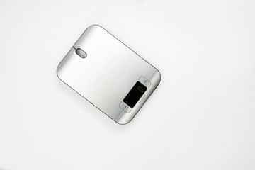 An electronic scale on white background