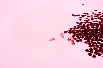 Pink background with red hearts. Valentine's day concept.