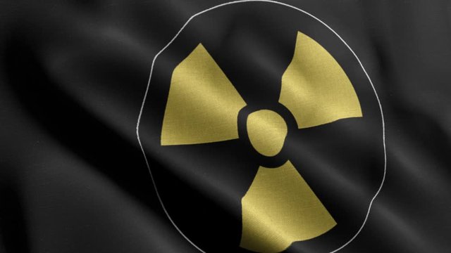 Closeup 4K waving flag of the nuclear logo in black background
