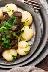 Potato dumplings and forest mushroom sauce