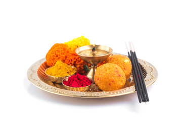 Beautifully Decorated Pooja Thali for festival celebration to worship, haldi or turmeric powder and...