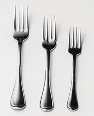Set of silver cutlery on a white background