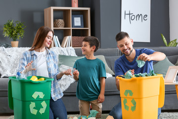 Family sorting garbage at home. Concept of recycling - Powered by Adobe