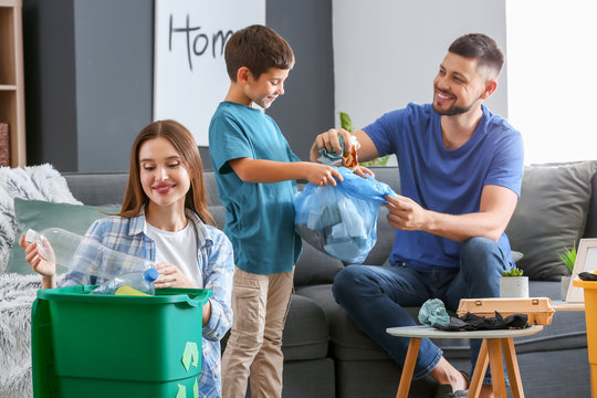 Family Sorting Garbage At Home. Concept Of Recycling