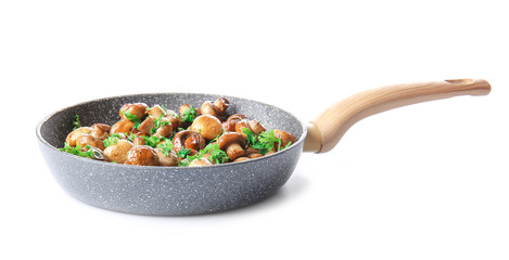 Frying pan with tasty cooked mushrooms on white background - obrazy, fototapety, plakaty