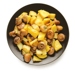 Plate with tasty cooked mushrooms and potato on white background