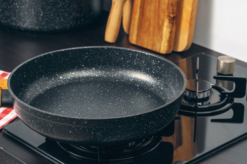 Frying pan on the gas stove in a kitchen