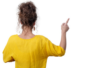 woman showing finger on copy space for product or text, back view, isolated