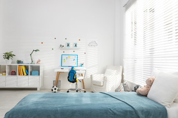 Modern child room interior with comfortable bed