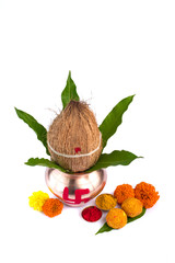 Copper Kalash with coconut, mango leaf, Haldi, kumkum and sweets with marigold flower decoration on...
