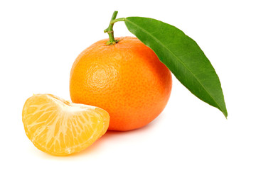 mandarin with slices and green leaves isolated on white background