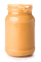 Tasty peanut butter in jar on white background