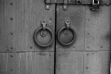 Door handles and deadbolt on the old cathedral door