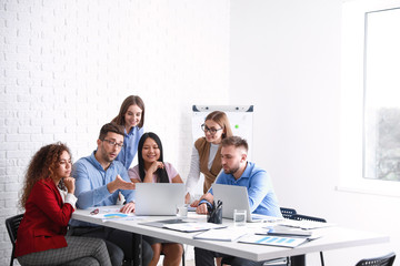 Colleagues discussing issue at business meeting in office