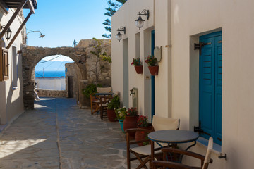 Fototapeta na wymiar A old street towards the sea in the Naxos city, Greece