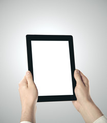 Hand holding digital tablet
