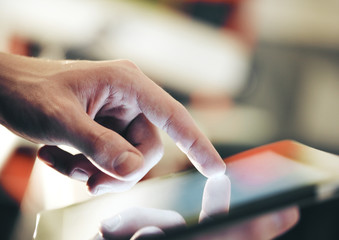 Businessman hand touching digital touch pad