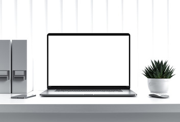 Laptop with blank screen on table in office interior building - mockup, template