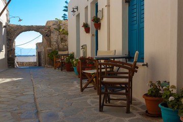 A old street towards the sea in the Naxos city, Greece