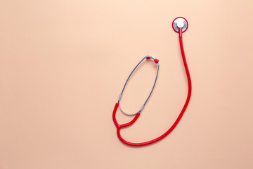 Stethoscope on color background. Cardiology concept