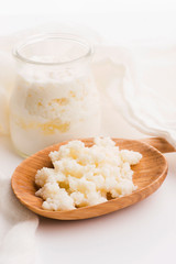 Milk kefir grains in spoon. Yeast bacterial fermentation starter