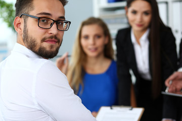 Obraz premium Handsome smiling bearded clerk man wearing glasses