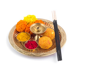 Beautifully Decorated Pooja Thali for festival celebration to worship, haldi or turmeric powder and...