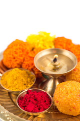 Beautifully Decorated Pooja Thali for festival celebration to worship, haldi or turmeric powder and...