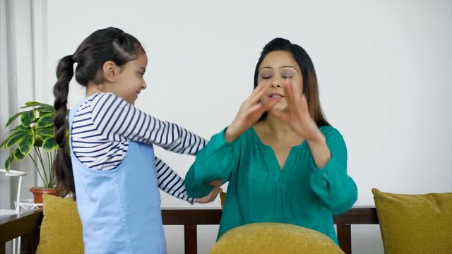 Little Indian girl troubling her mother as she demands her to come with her. Annoyed mother and persistent daughter - Tough parenting. 4K Stock Footage of an Indian mother getting annoyed with her ...